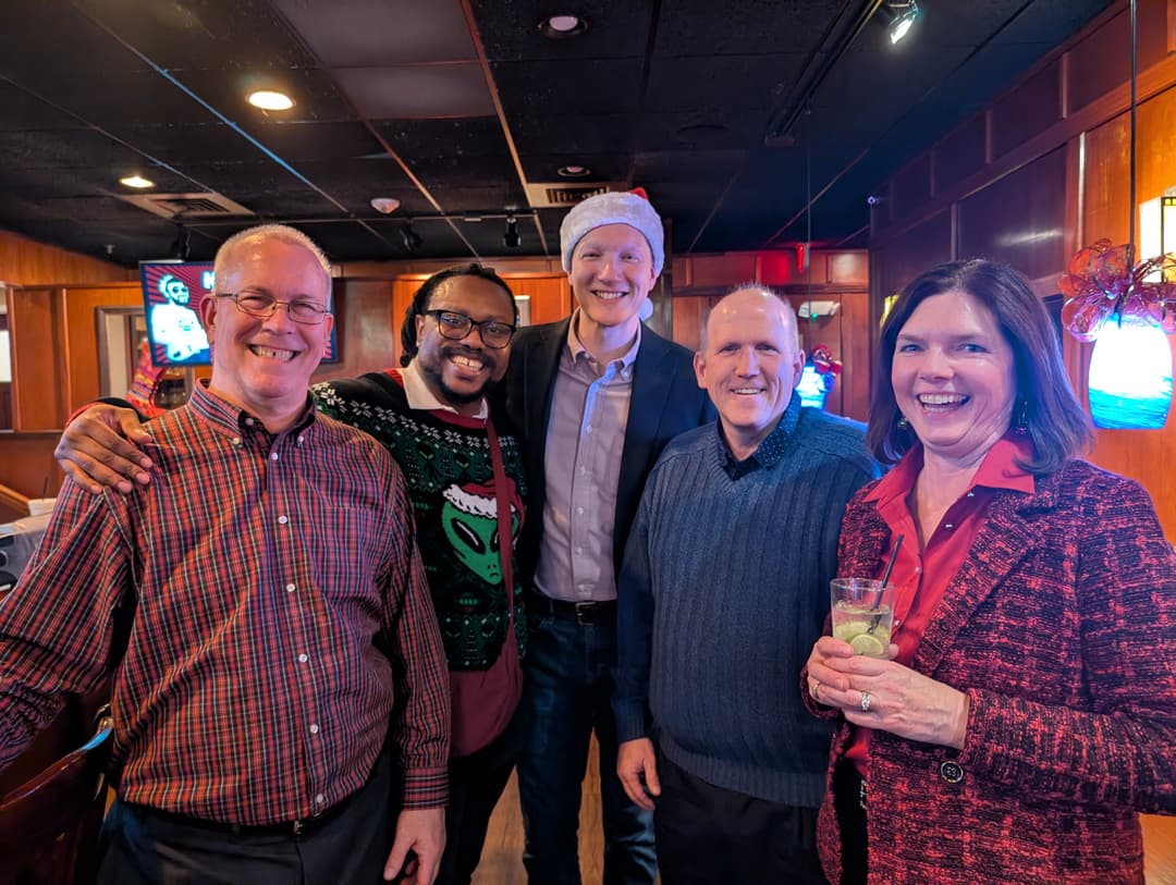 team taking photo together again